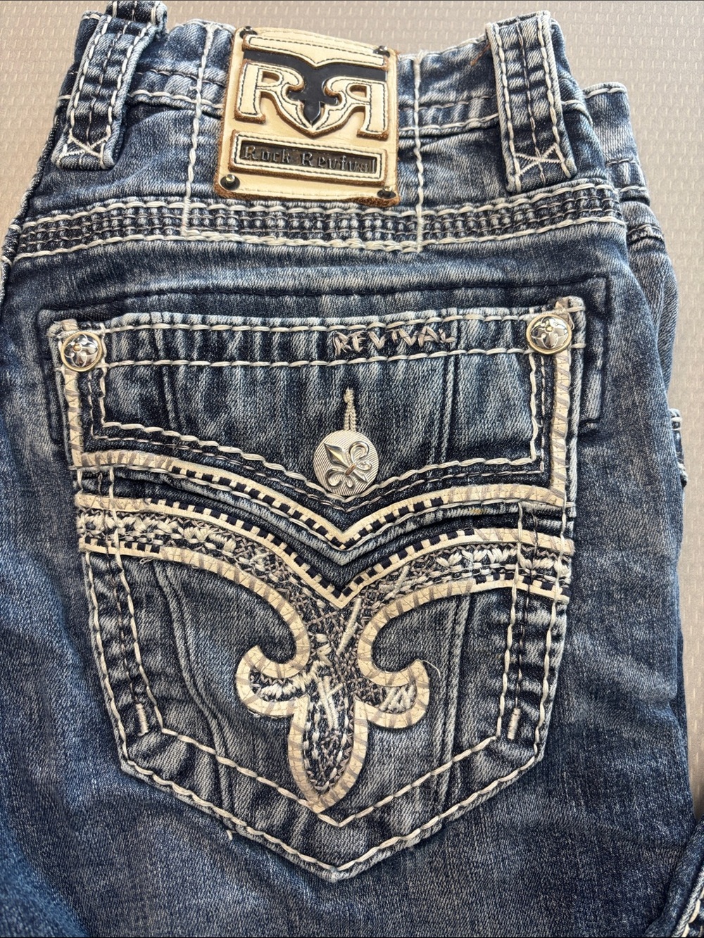 Rock Revival Blue Denim Bootcut Jeans with Cream Stitching & Gold Logo